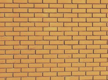 Full frame shot of yellow brick wall