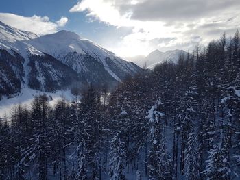 Scenic view of mountains against sky during winter