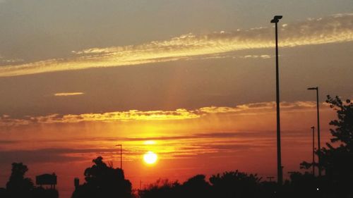 Scenic view of sunset over city