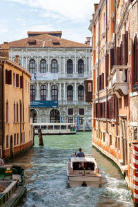 View of canal passing through buildings