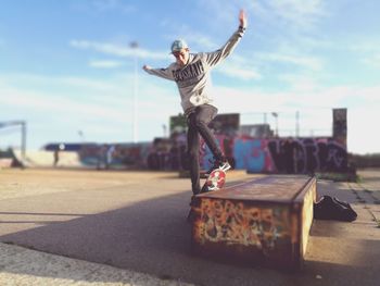 Man jumping in front of building