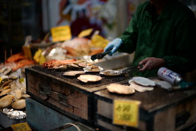 Man preparing food for sale in market