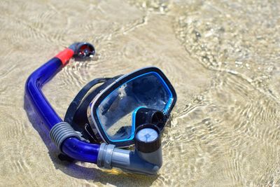 High angle view of sunglasses on beach