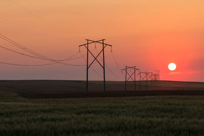 Scenic view of field against sky during sunset