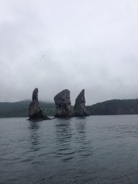 Scenic view of sea against cloudy sky