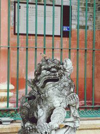 Statue against building
