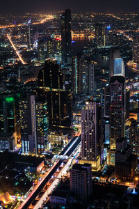 High angle view of illuminated cityscape at night