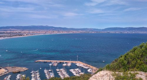 High angle view of sea and bay against sky