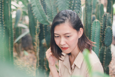 Portrait of young woman looking away