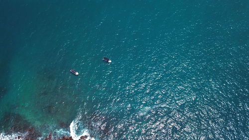 High angle view of sea against blue sky