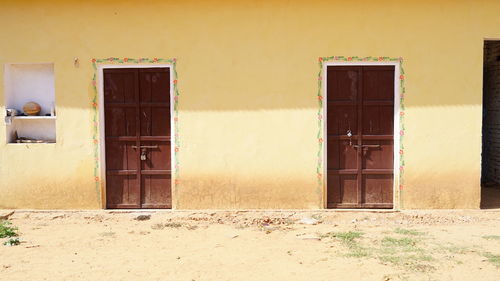 Traditional indian house door, two traditional doors. old building with closed doors on main street