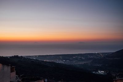 High angle view of townscape against sky during sunset