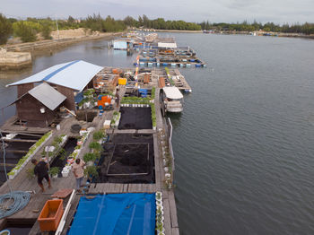 High angle view of river amidst buildings