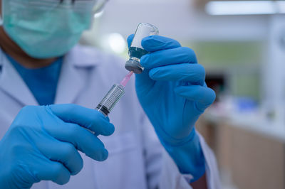 Man working in blue machine