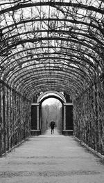 Man walking in archway