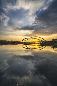 Seri empangan bridge over lake against sky during sunset