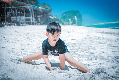 Boy looking at sea shore