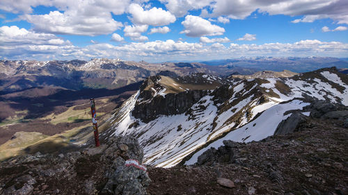 Scenic view of mountains against sky during winter