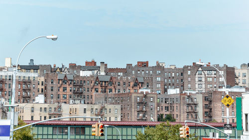 Panoramic roof view of old houses. brick buildings with fire stairs during the day.  bronx, nyc, usa