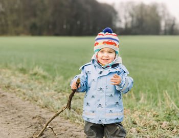 Boy standing on field