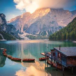 Scenic view of lake and mountains against sky