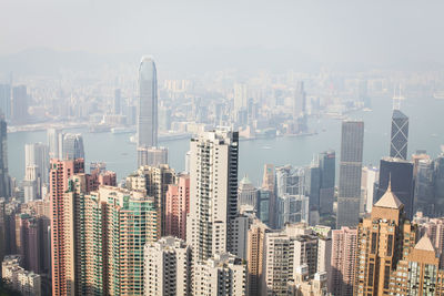 Aerial view of modern buildings in city against sky