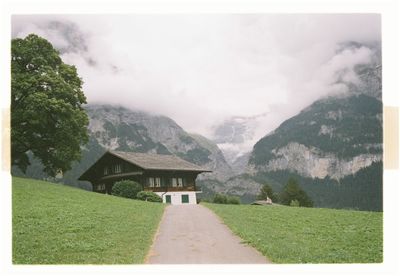 Houses and mountains against sky