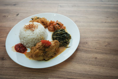 High angle view of food served in plate on table