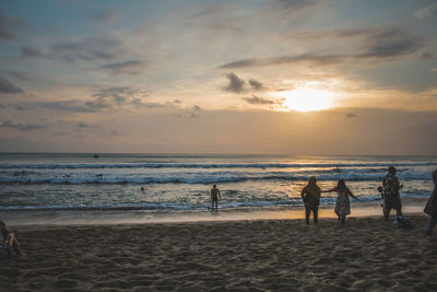 Scenic view of beach against sky during sunset