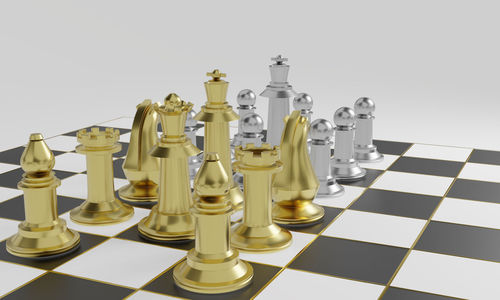 Close-up of chess board against white background