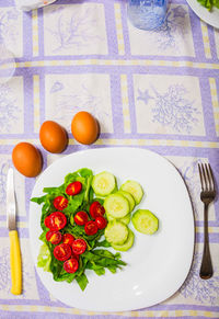 High angle view of fruits in plate on table