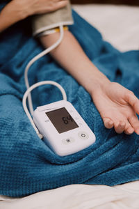 Midsection of woman using mobile phone