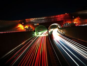 Light trails on road in city at night