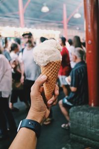 People holding ice cream outdoors