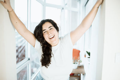 Portrait of smiling young woman at home