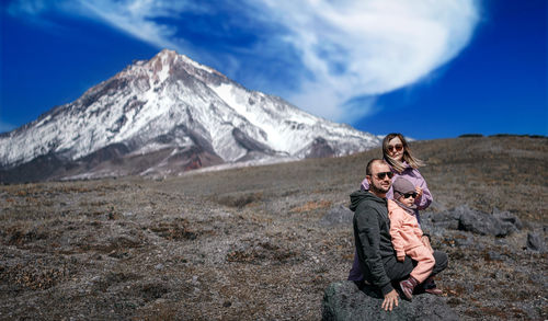 Full length of man and snowcapped mountains against sky