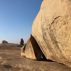 Rock formations in desert against clear sky