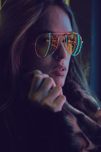 Close-up of young woman wearing sunglasses