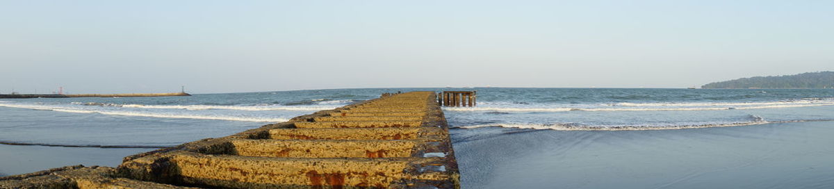 Panoramic view of sea against clear sky