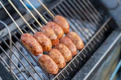 High angle view of meat on barbecue grill