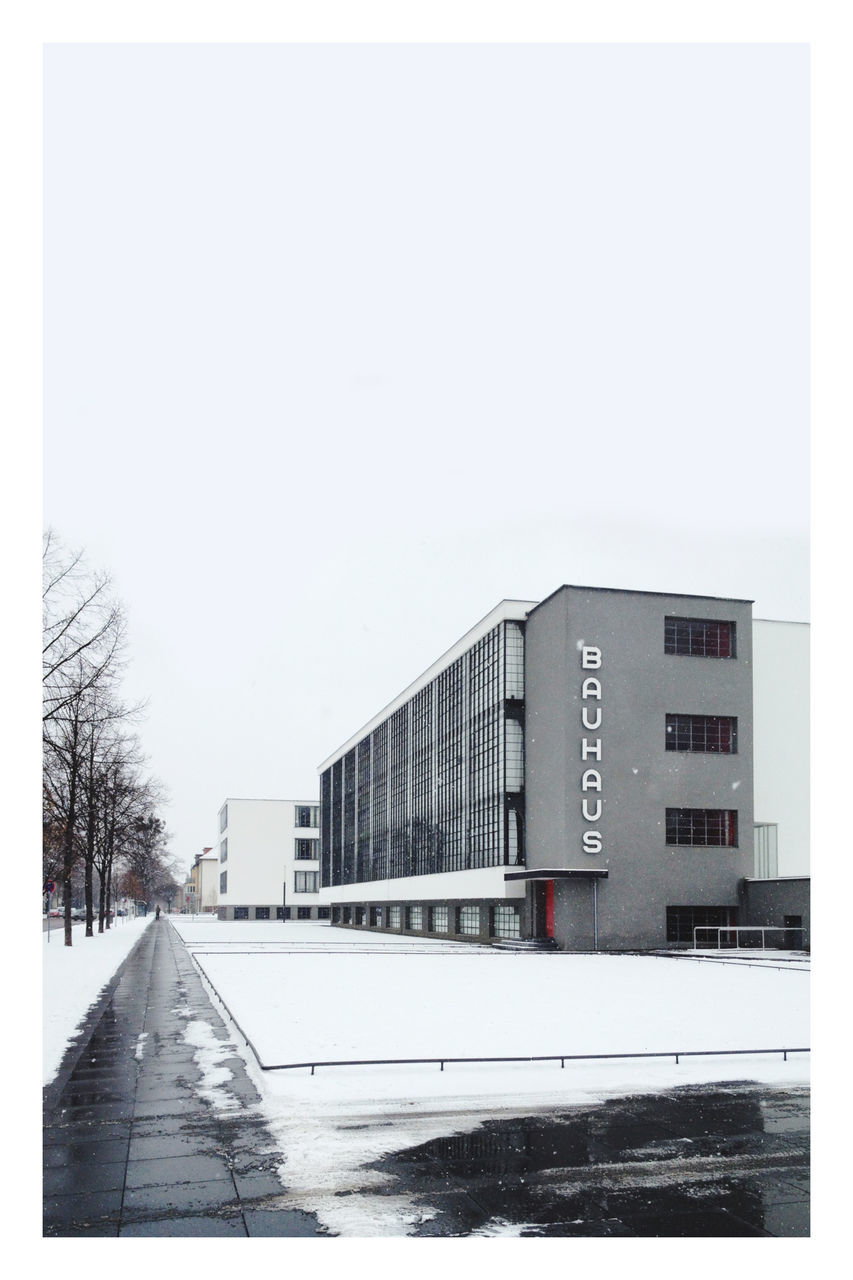 architecture, built structure, building exterior, snow, cold temperature, winter, sky, city, building, nature, no people, transfer print, auto post production filter, day, copy space, outdoors, transportation, tree, clear sky, road, white