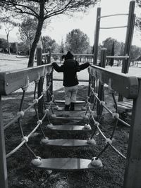 Rear view of man standing on road