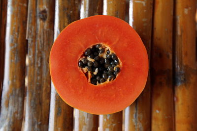 Cross section of papaya on table