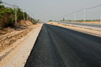 Empty road against clear sky