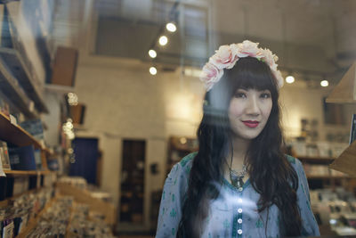 Portrait of young woman standing outdoors