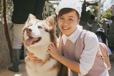 Portrait of smiling woman with dog