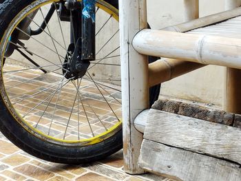 Close-up of bicycle wheel on footpath