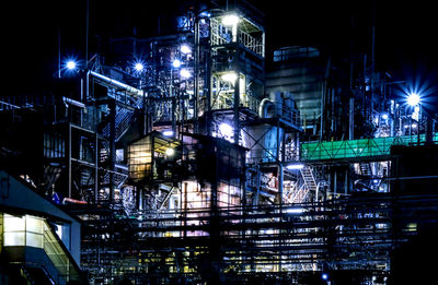 Low angle view of illuminated buildings at night