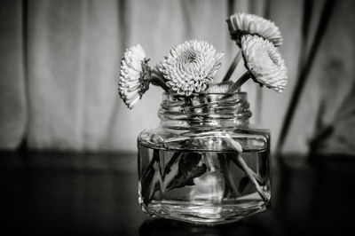 Close-up of vase in jar on table