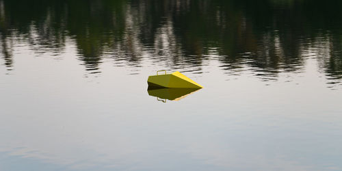 High angle view of yellow floating on water